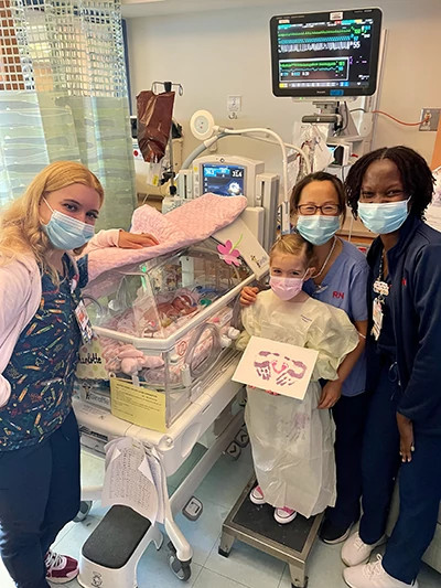 Charley, Dempsey, and members of the NICU team