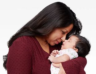 Photo of Aguilar belky holding her newborn