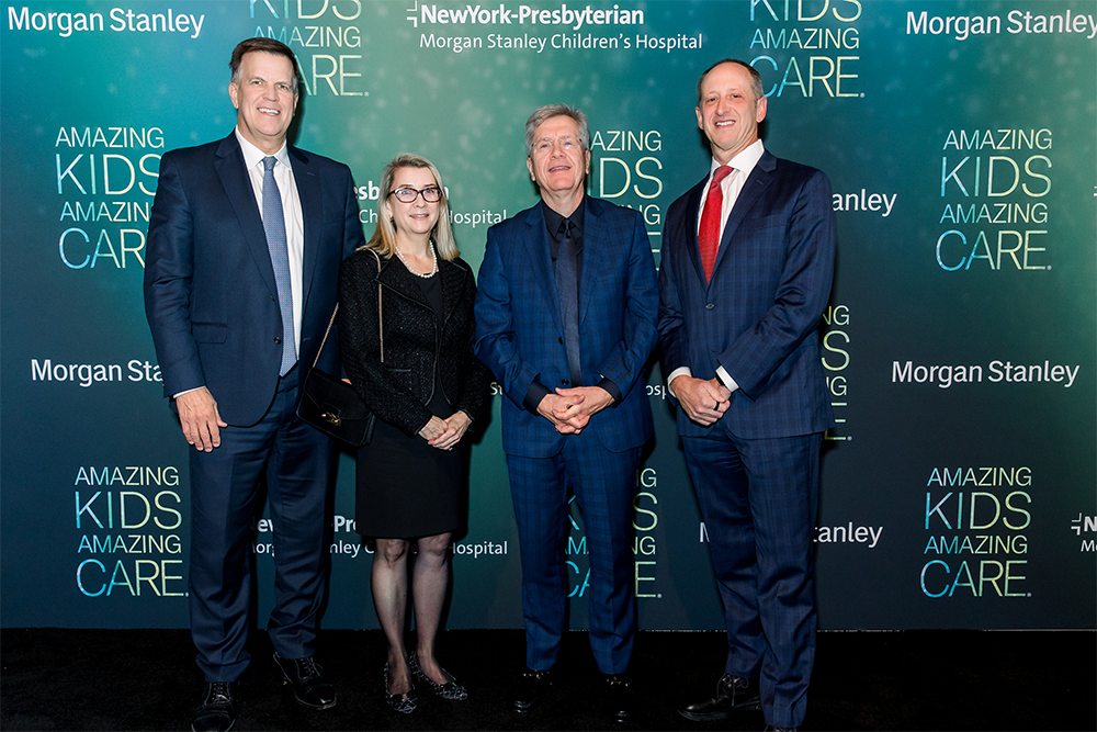 People formally dressed and standing together.