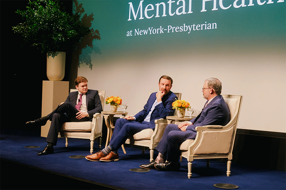 Panel sitting on a stage.