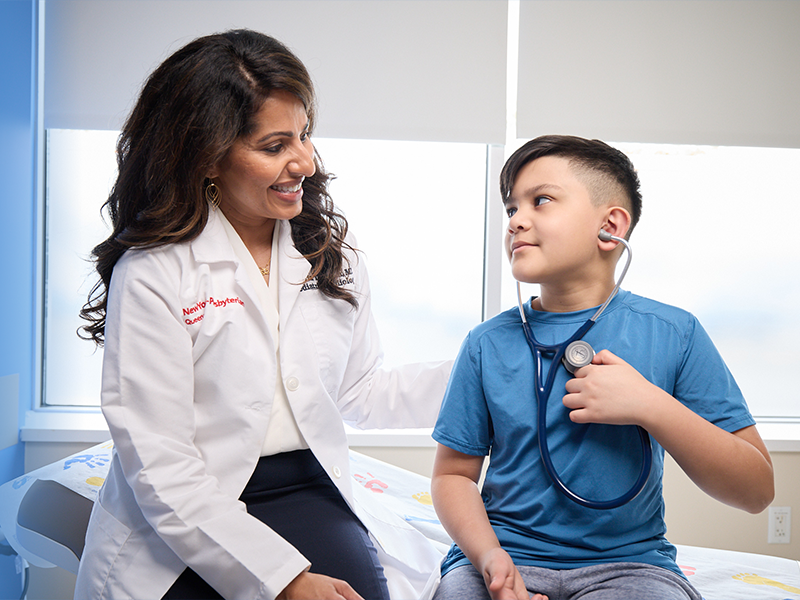 Maria T. Thanjan and pediatric patient